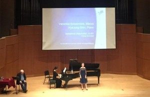 Veronika Anissimova and pianist Hye Jung Shin performing for Graham Johnson